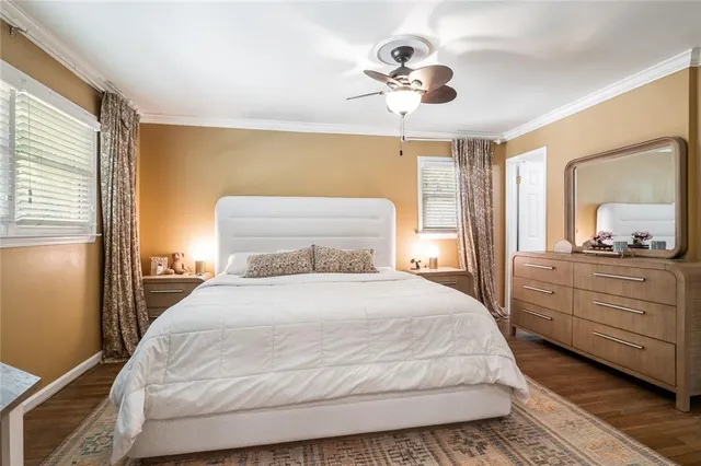 a bedroom with a large bed and a dresser