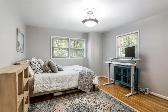 a bedroom with a bed and a fireplace