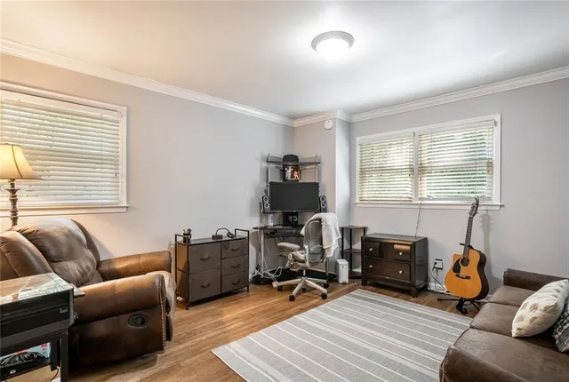 a livingroom with workspace and a couch