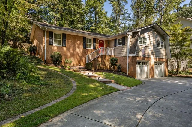 a front view of house with yard and green space