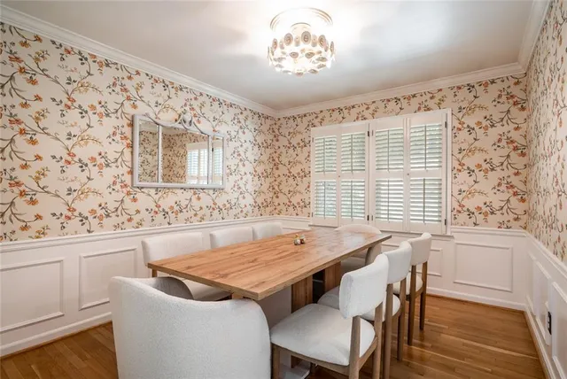 a view of a dining room with furniture and window