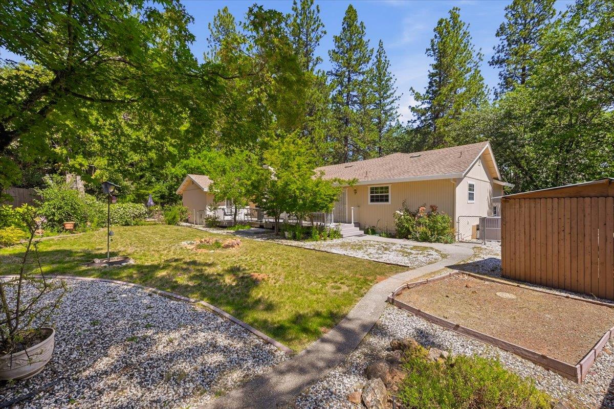 12600 Friar Tuck Road Grass Valley, CA 95949 - Photo 37 of 56 a view of a house with backyard and trees