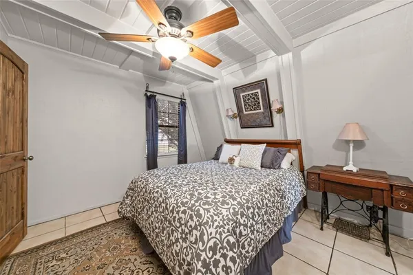 a bedroom with a bed and a table in it