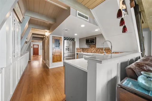 a kitchen with stainless steel appliances granite countertop lots of counter top space