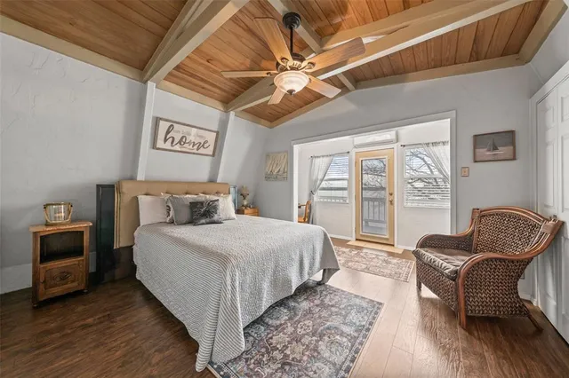 a bedroom with bed and a couch