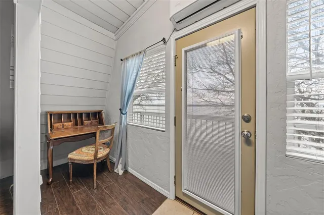 a view of a room that has a bed and a window
