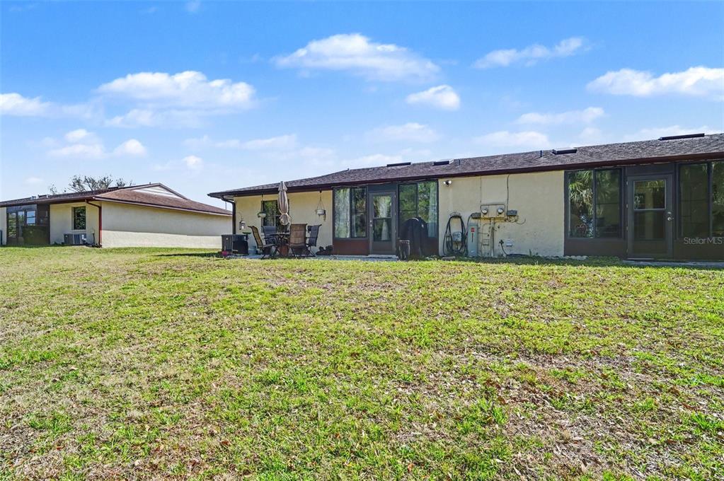 12435 Orangewood Circle Tavares, FL 32778 - Photo 30 of 30 front view of a house with a yard