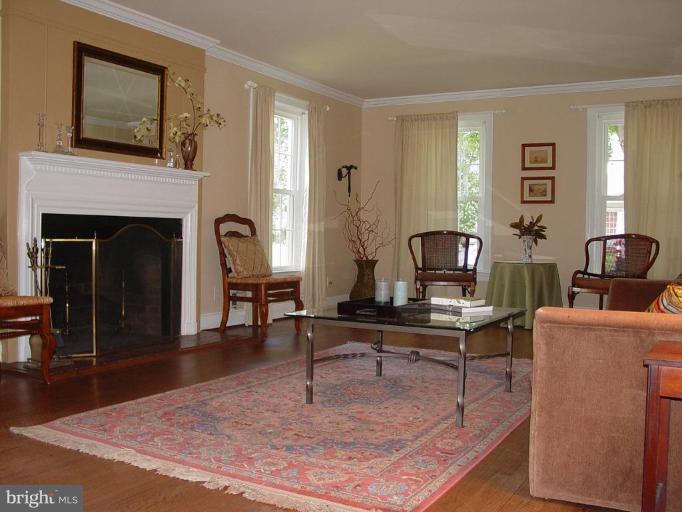 106 Yorkleigh Road Towson, MD 21204 - Photo 4 of 26 Graciously sized living room w/ fp, crown molding.