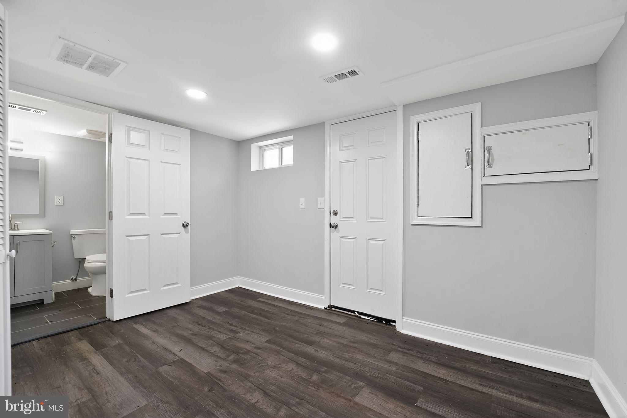 3807 Elkader Road Baltimore, MD 21218 - Photo 18 of 30 a view of empty room with wooden floor