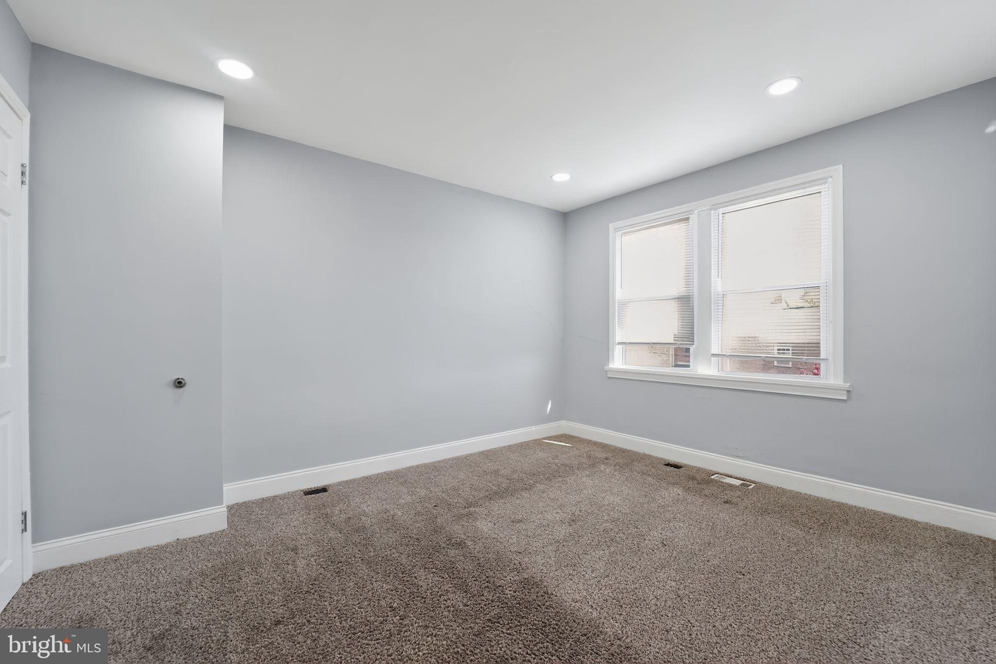 3807 Elkader Road Baltimore, MD 21218 - Photo 22 of 30 an empty room with windows