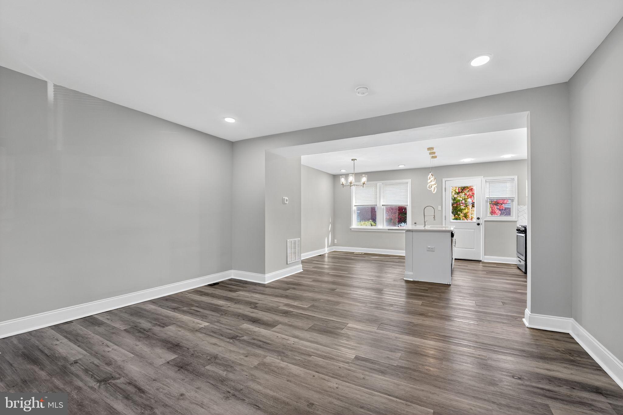 3807 Elkader Road Baltimore, MD 21218 - Photo 27 of 30 a view of kitchen and hall with wooden floor