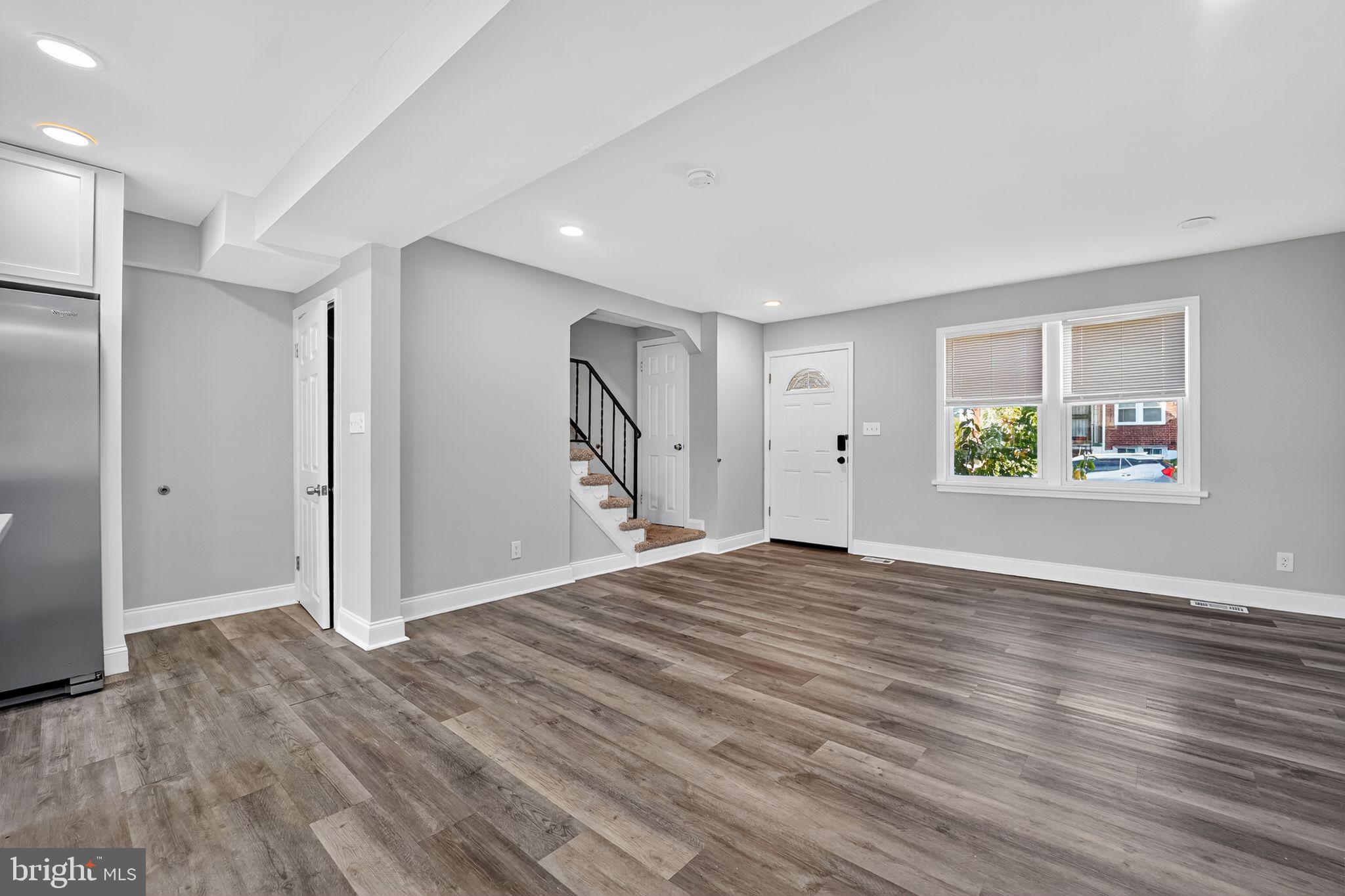 3807 Elkader Road Baltimore, MD 21218 - Photo 28 of 30 an empty room with window and wooden floor