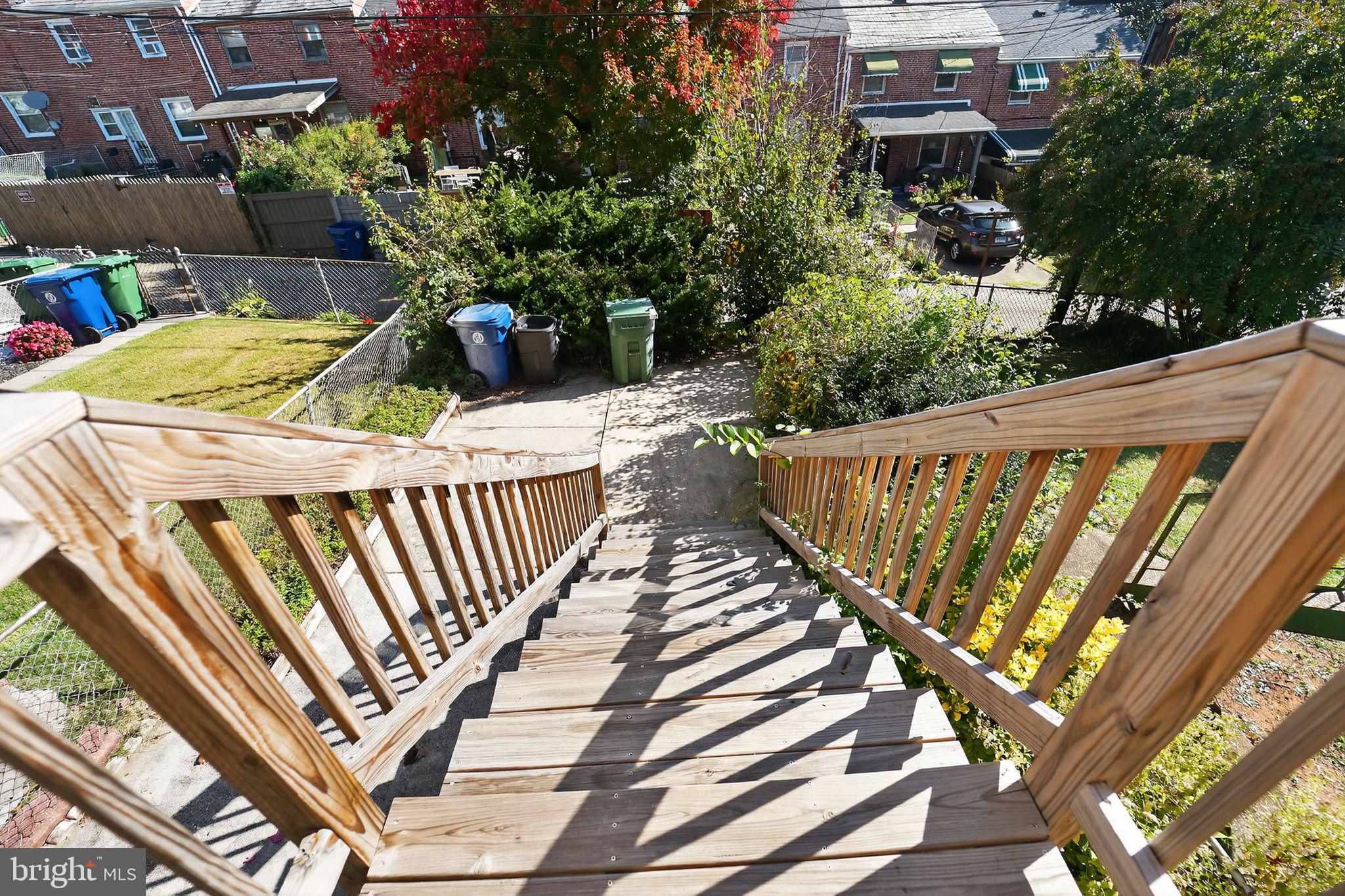 3807 Elkader Road Baltimore, MD 21218 - Photo 29 of 30 a view of balcony with wooden floor and outdoor seating