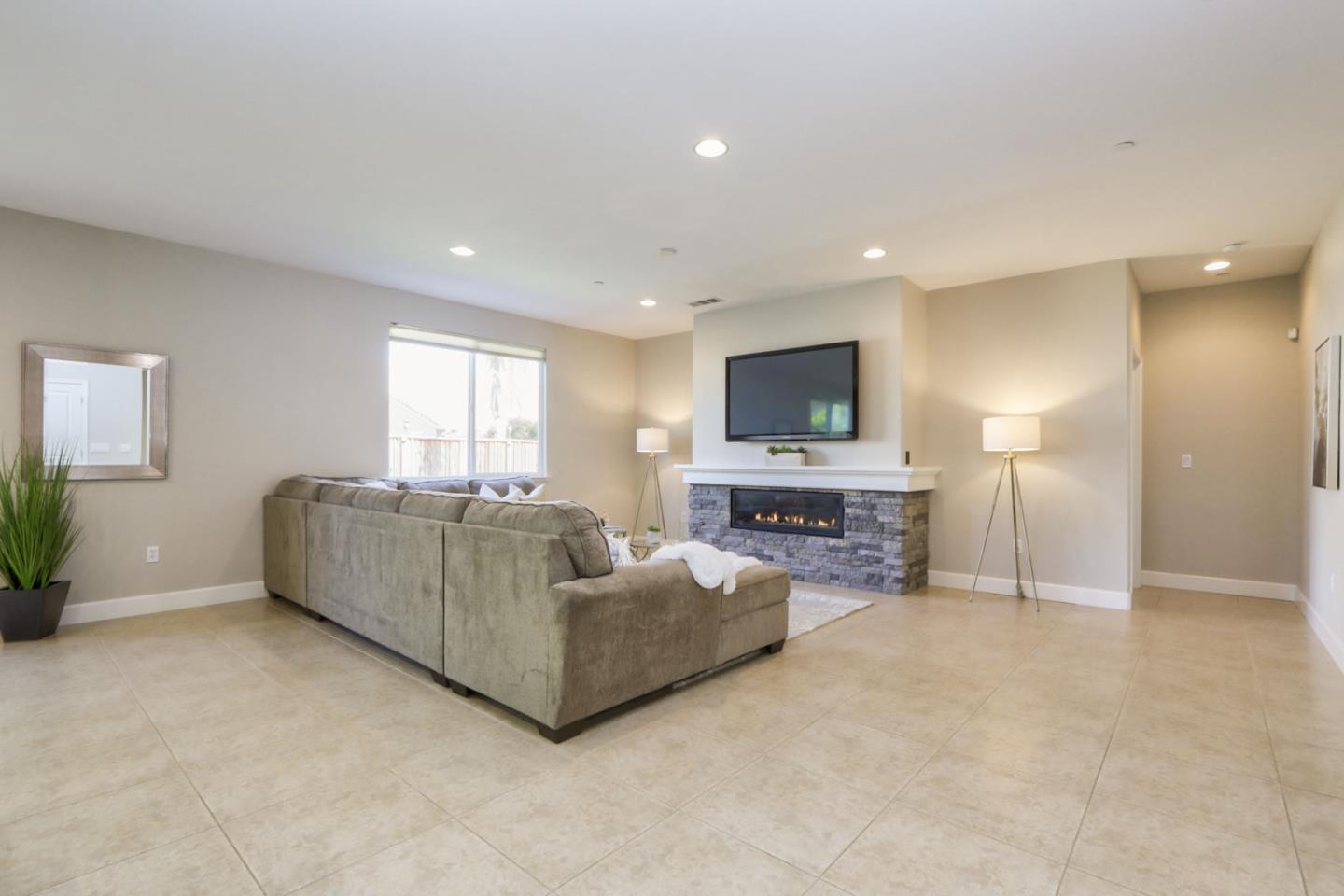 9534 Rodeo Drive Gilroy, CA 95020 - Photo 12 of 73 a living room with furniture and a flat screen tv