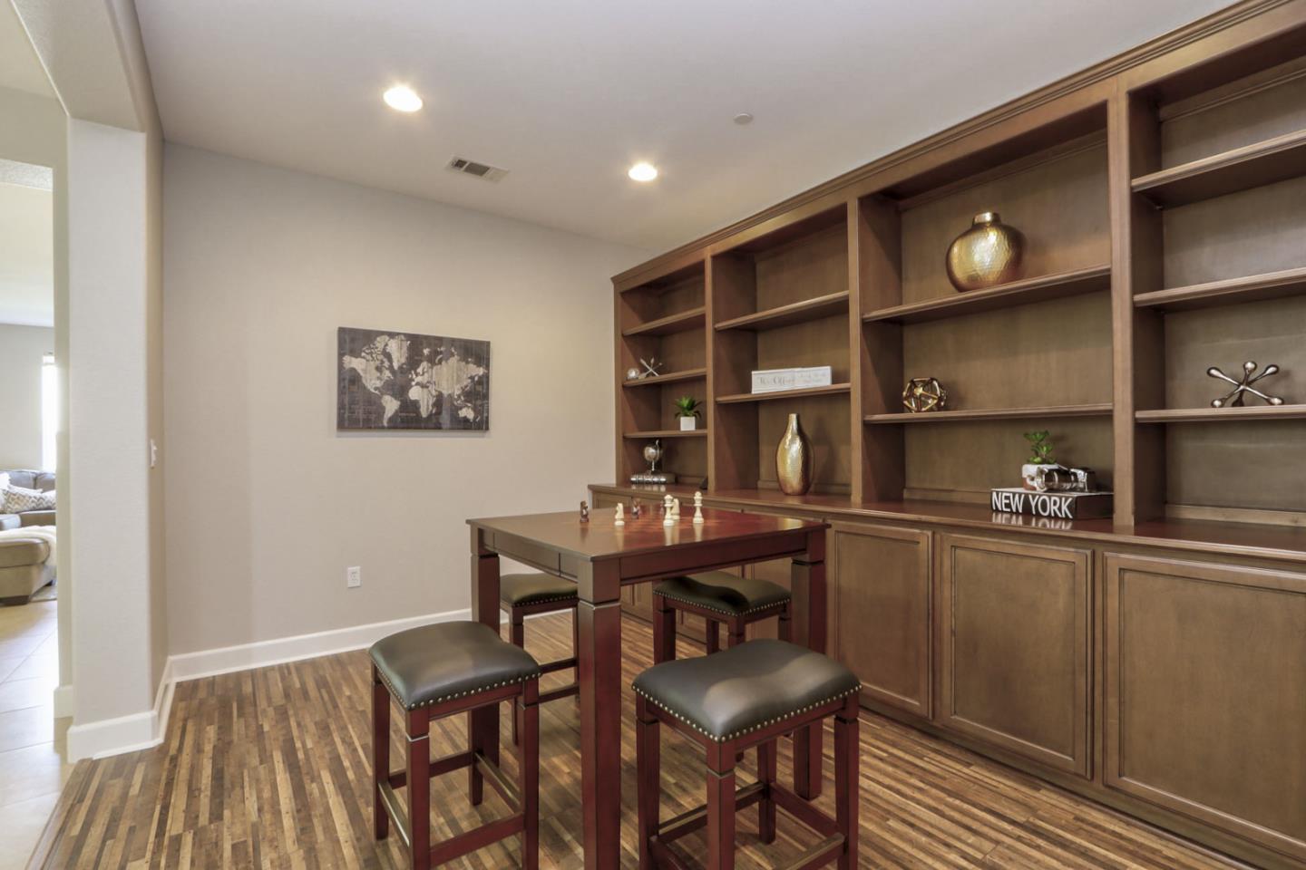 9534 Rodeo Drive Gilroy, CA 95020 - Photo 34 of 73 a room with stainless steel appliances wooden floor and chairs