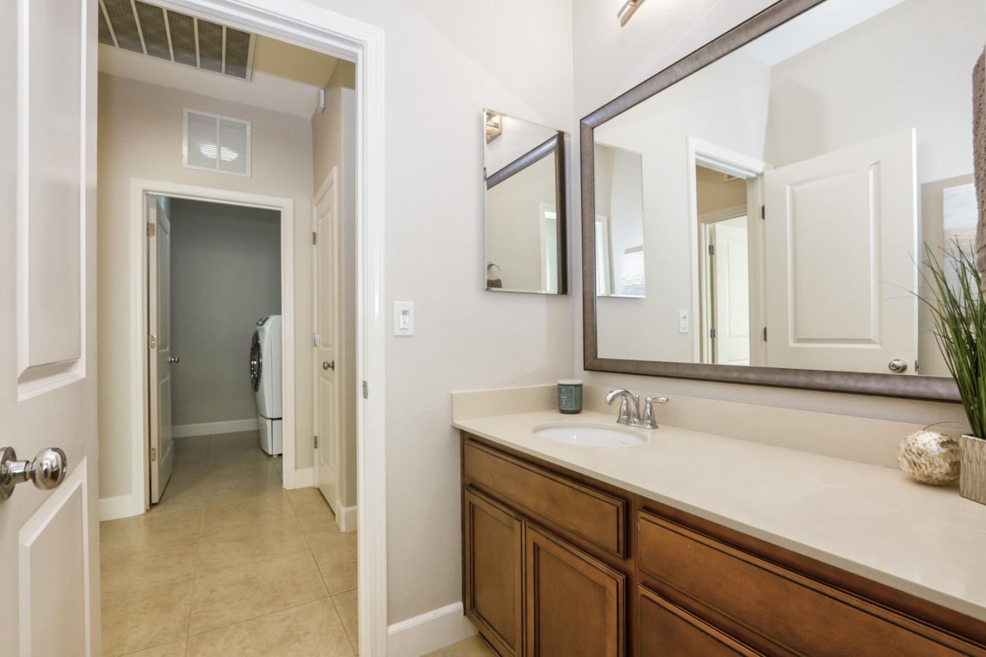 9534 Rodeo Drive Gilroy, CA 95020 - Photo 39 of 73 a bathroom with a sink and a mirror
