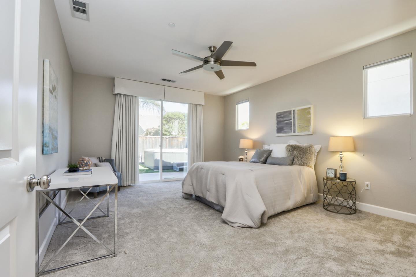9534 Rodeo Drive Gilroy, CA 95020 - Photo 44 of 73 a spacious bedroom with a bed and a table