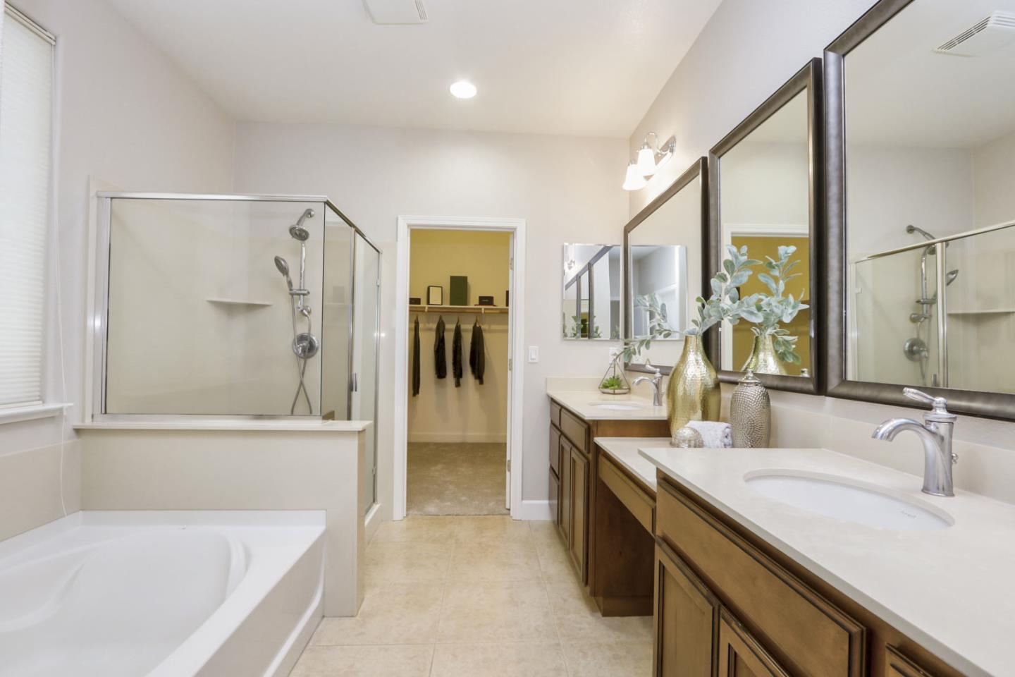 9534 Rodeo Drive Gilroy, CA 95020 - Photo 47 of 73 a bathroom with a tub sink and mirror