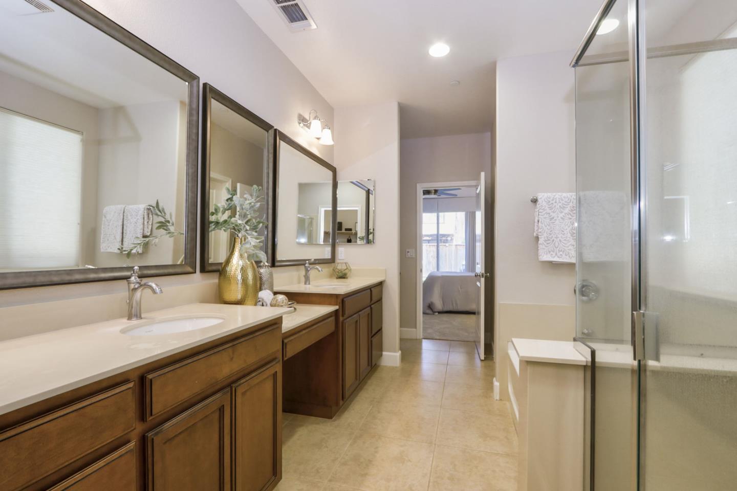 9534 Rodeo Drive Gilroy, CA 95020 - Photo 48 of 73 a bathroom with a sink double vanity and a mirror