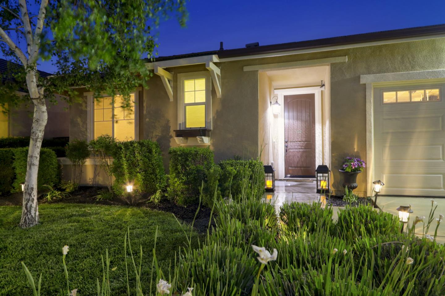 9534 Rodeo Drive Gilroy, CA 95020 - Photo 5 of 73 a front view of a house with a yard