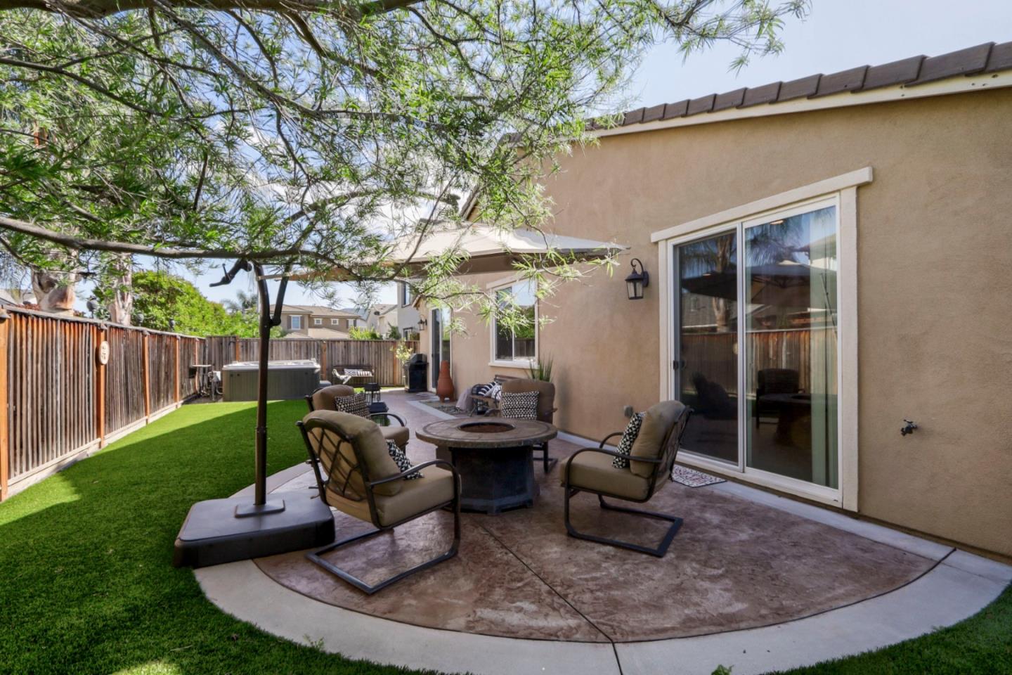 9534 Rodeo Drive Gilroy, CA 95020 - Photo 53 of 73 a view of a patio with couches table and chairs and potted plants