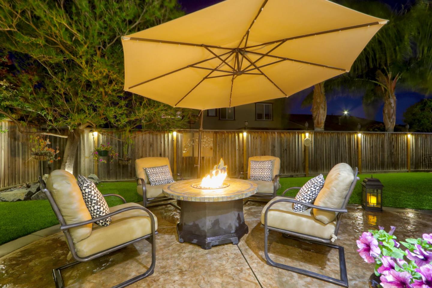 9534 Rodeo Drive Gilroy, CA 95020 - Photo 60 of 73 a patio with a table and chairs under an umbrella
