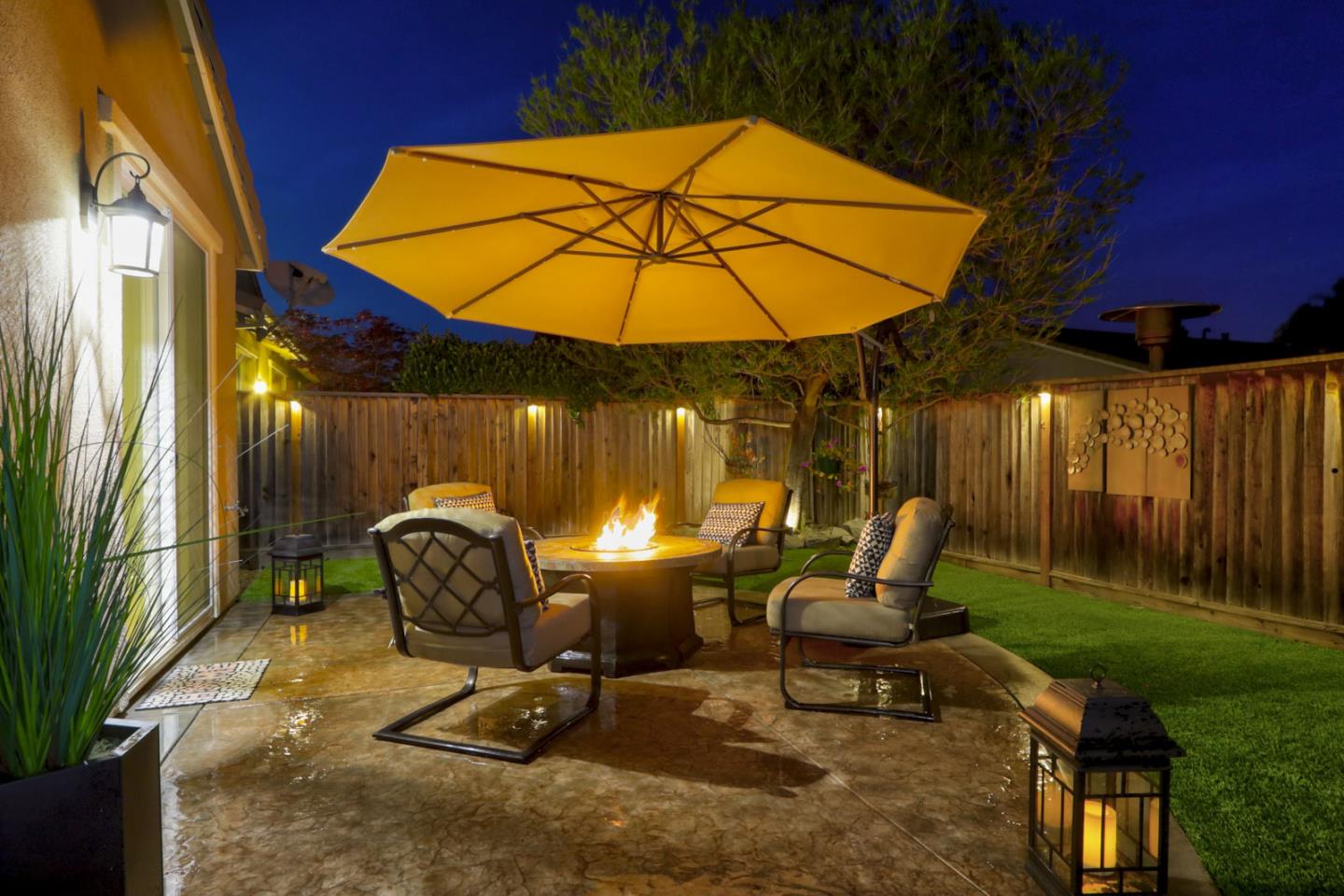 9534 Rodeo Drive Gilroy, CA 95020 - Photo 62 of 73 a view of a patio with table and chairs under an umbrella