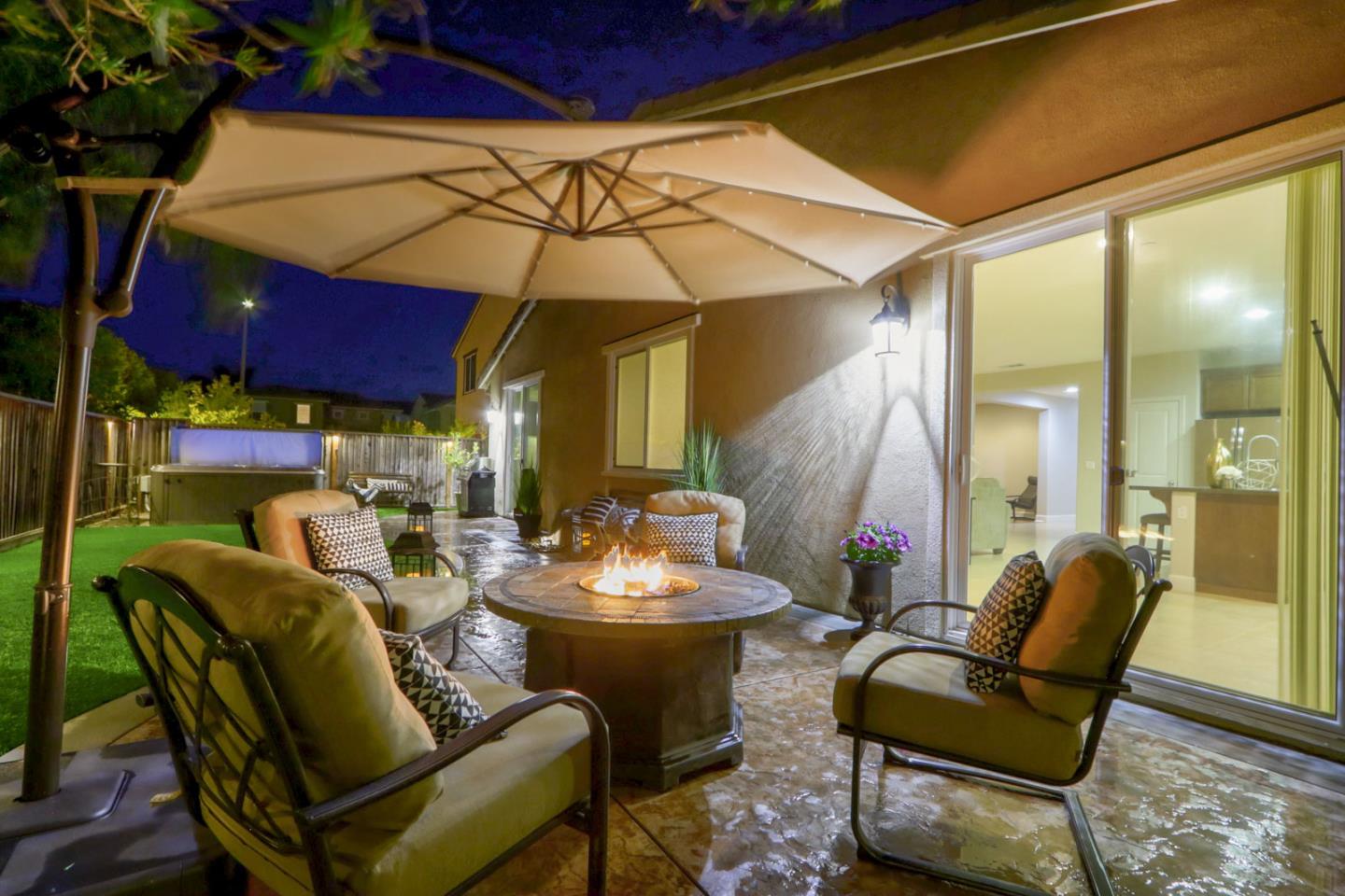 9534 Rodeo Drive Gilroy, CA 95020 - Photo 66 of 73 a view of a patio with a dining table and chairs