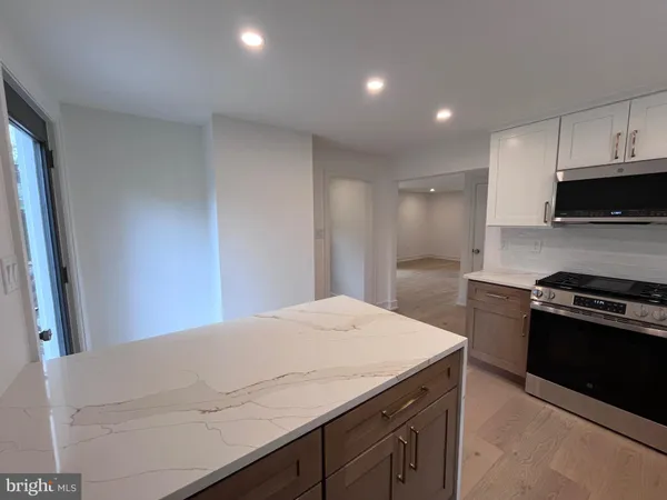 a kitchen with a stove and a sink