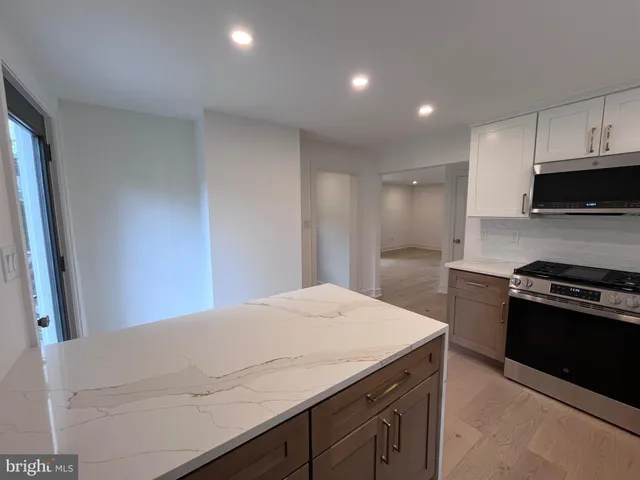 a kitchen with a stove and a sink