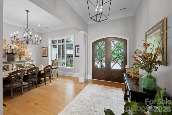 a living room with furniture fireplace and a large window