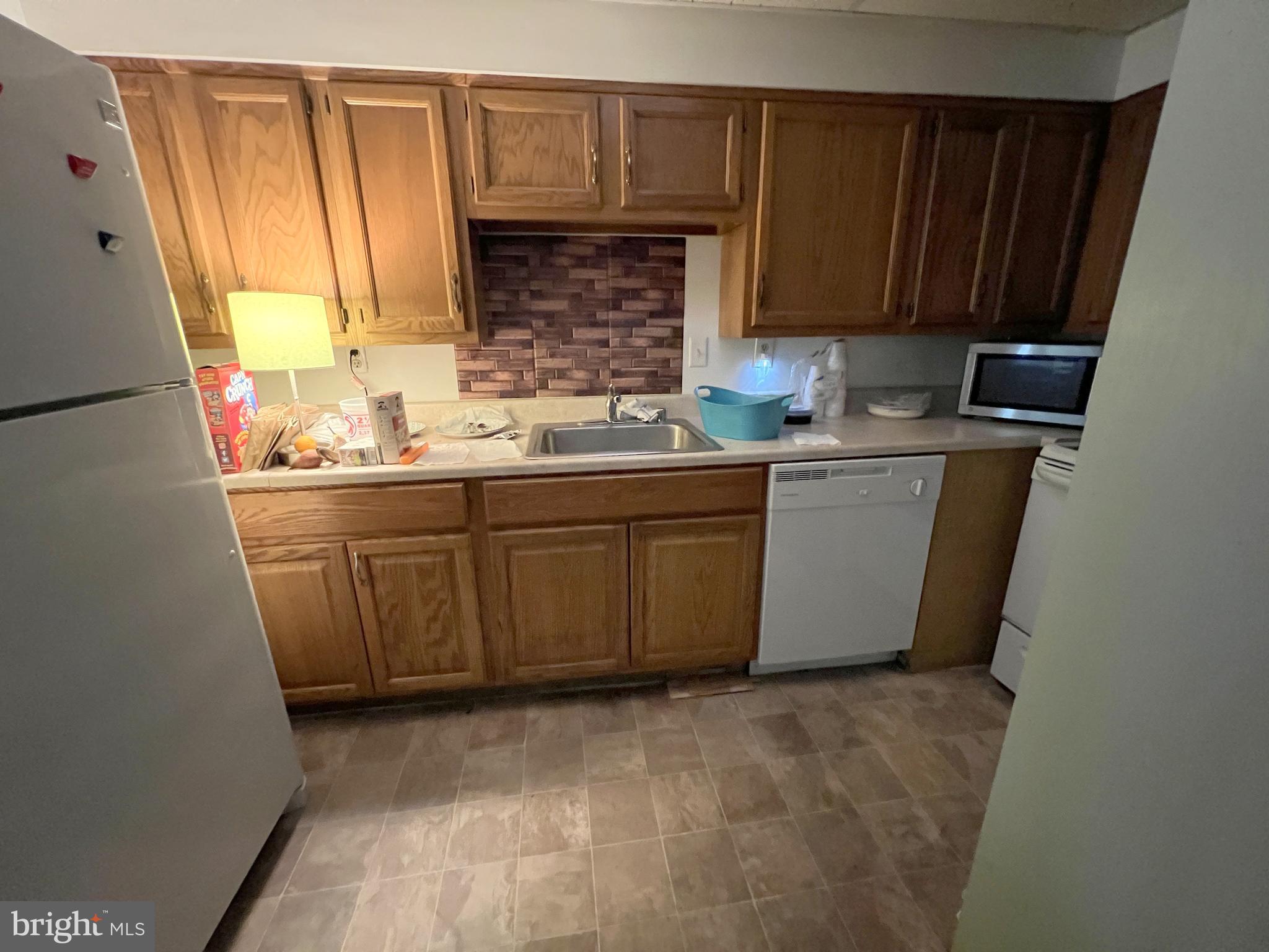 56 Welsh Tract Road Newark, DE 19713 - Photo 15 of 18 a kitchen with a sink a window and cabinets