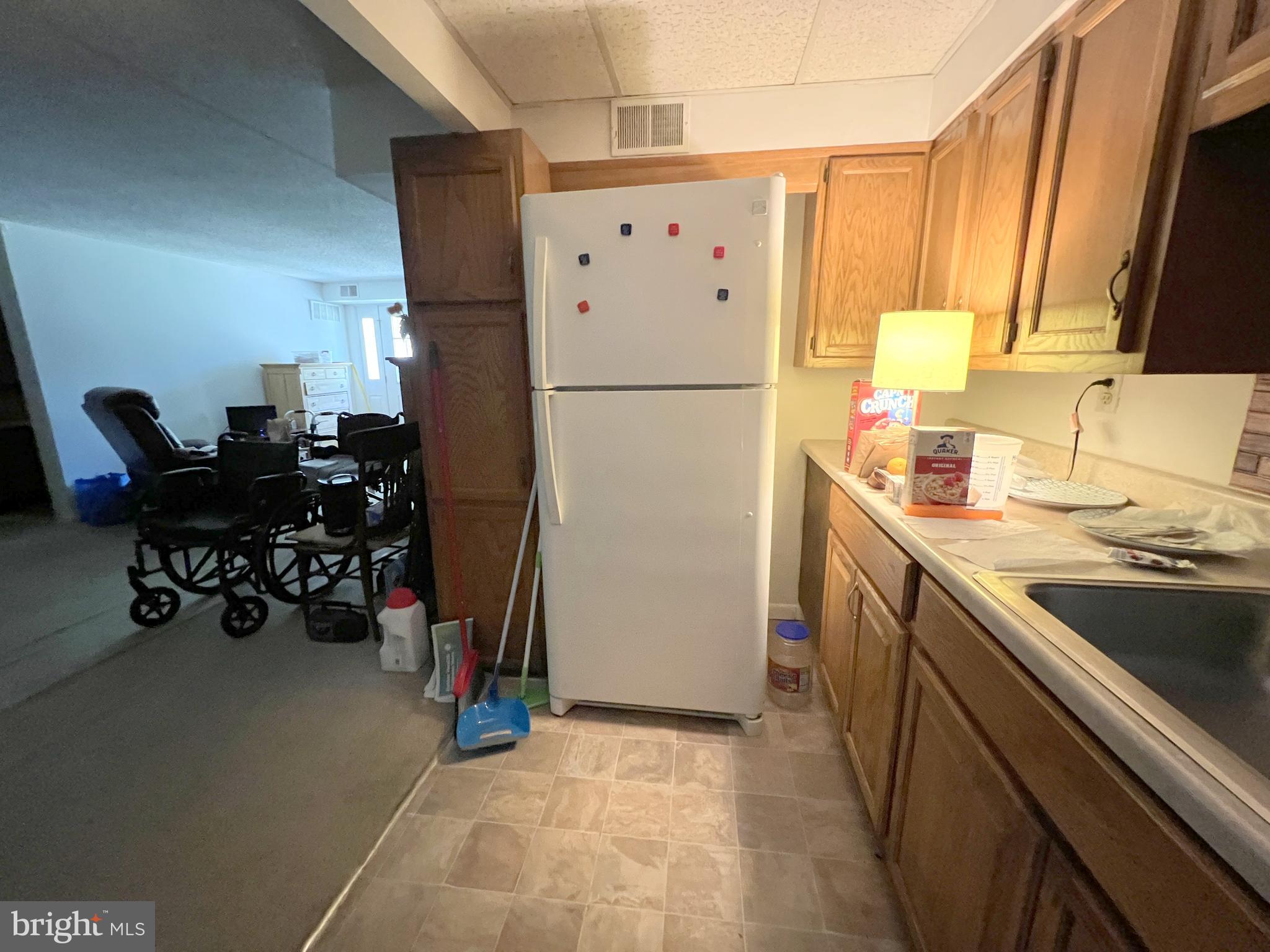 56 Welsh Tract Road Newark, DE 19713 - Photo 17 of 18 a kitchen with a refrigerator and a sink