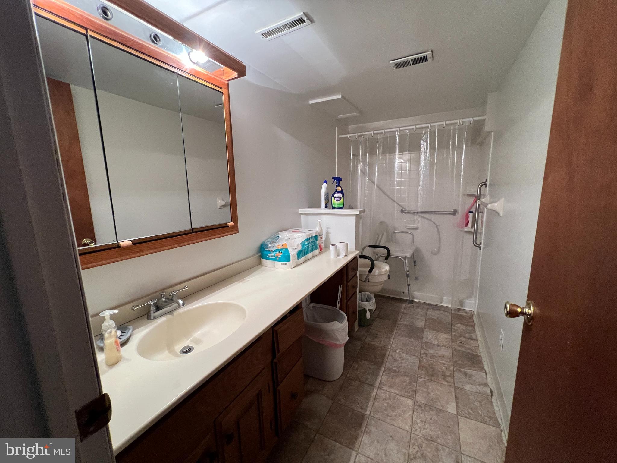 56 Welsh Tract Road Newark, DE 19713 - Photo 5 of 18 a bathroom with a double vanity sink mirror and toilet