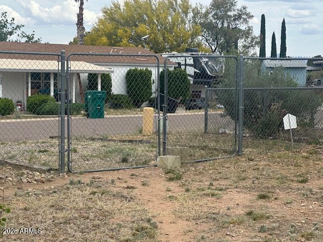 7258 South Lariat Road Hereford, AZ 85615 - Photo 31 of 37 a view of a house with a backyard