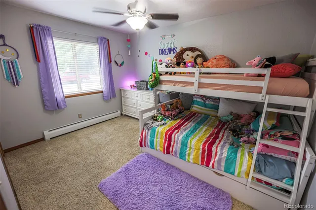 a view of a bedroom with furniture and toys