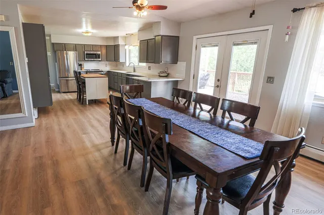 a view of a dining room with furniture window and wooden floor