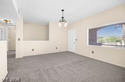 7701 West Robindale Road, Unit 277 Las Vegas, NV 89113 - Photo 5 of 33 A versatile living area with a bright window overlooking serene outdoor scenery awaits.