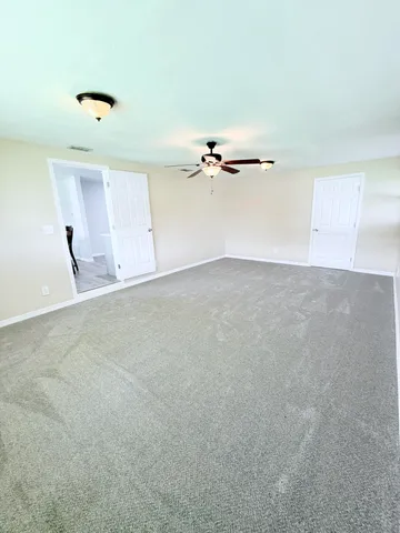 a view of a room with a fan