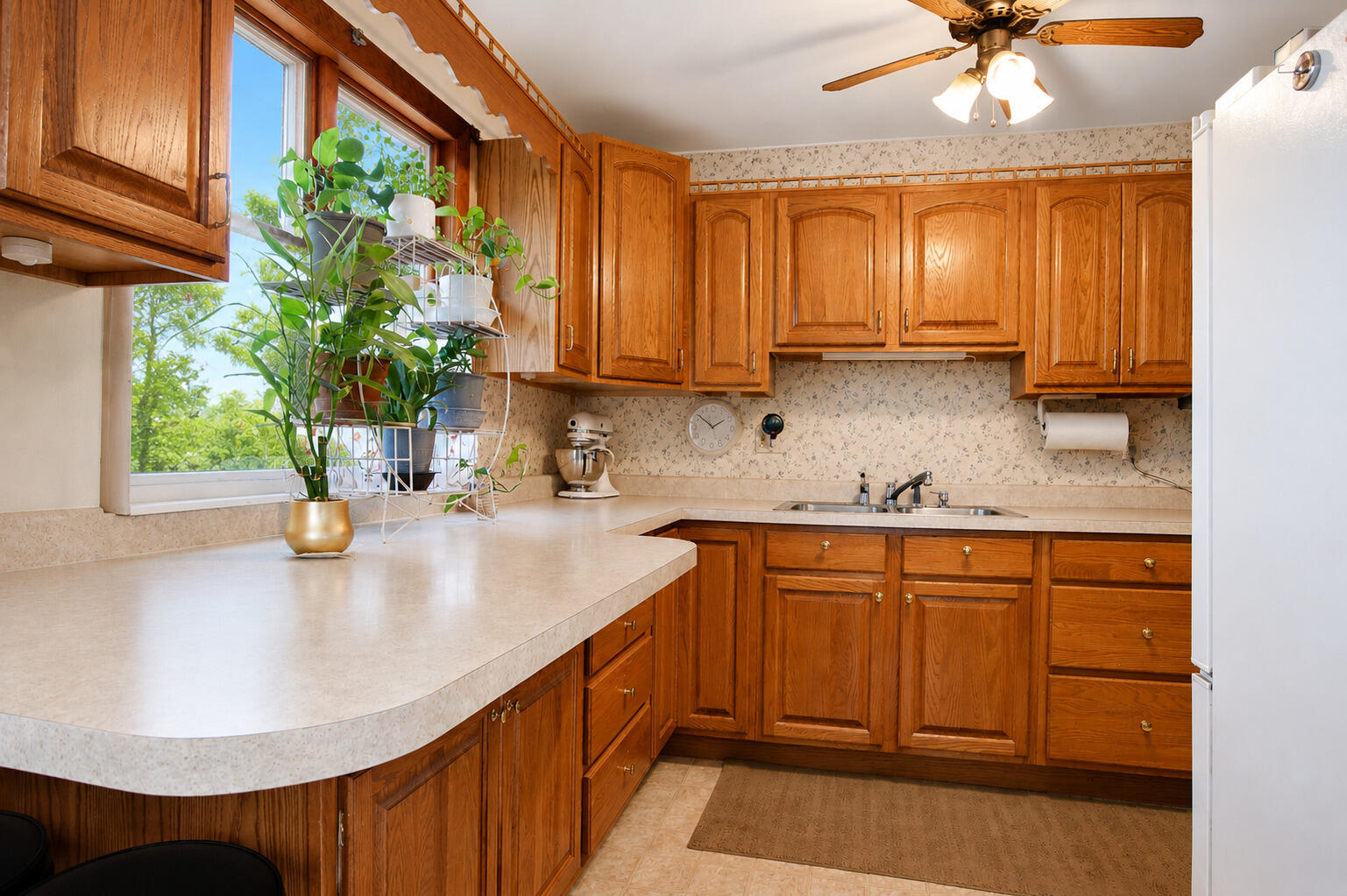 9502 Forrest Drive Highland, IN 46322 - Photo 10 of 27 a kitchen with stainless steel appliances granite countertop a sink a window and cabinets