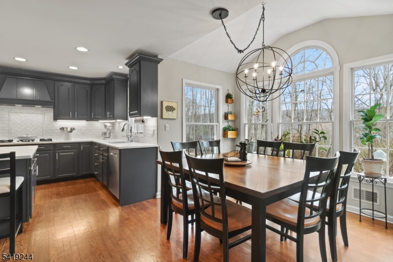 57 Paderewski Road Oak Ridge, NJ 07438 - Photo 11 of 42 a view of a dining room with furniture window and wooden floor