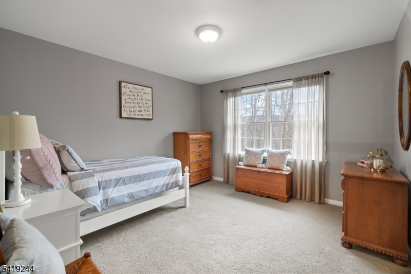 57 Paderewski Road Oak Ridge, NJ 07438 - Photo 19 of 42 a bedroom with furniture and a window