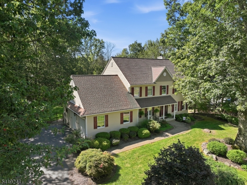 57 Paderewski Road Oak Ridge, NJ 07438 - Photo 2 of 42 front view of a house with a yard