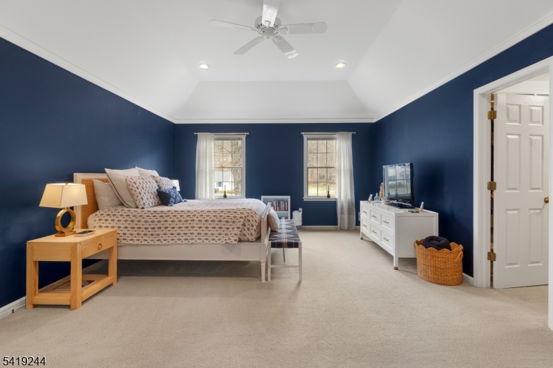 57 Paderewski Road Oak Ridge, NJ 07438 - Photo 23 of 42 a bedroom with a bed and a couch