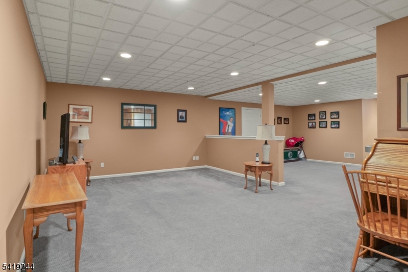 57 Paderewski Road Oak Ridge, NJ 07438 - Photo 26 of 42 an empty room with furniture and windows