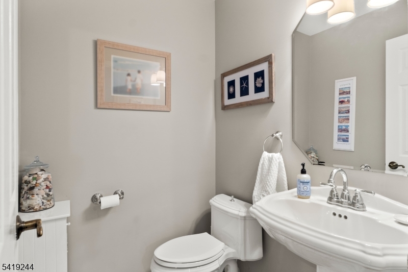 57 Paderewski Road Oak Ridge, NJ 07438 - Photo 31 of 42 a white toilet sitting next to a bathroom sink