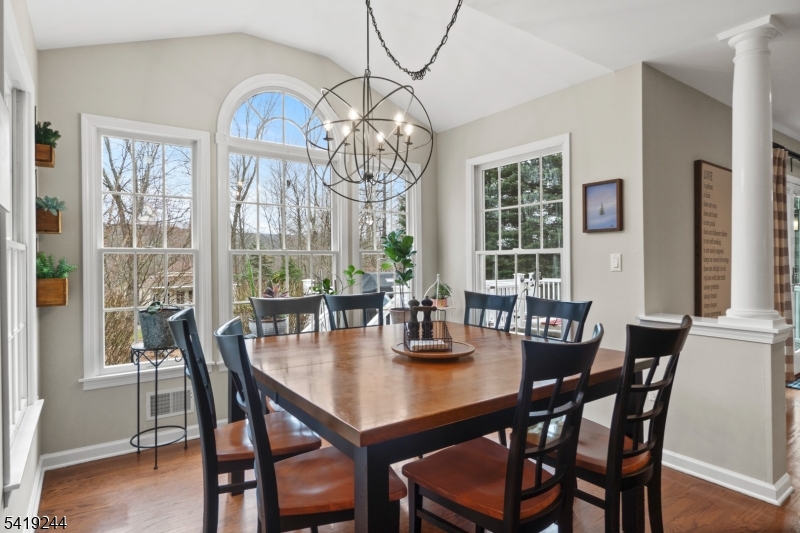 57 Paderewski Road Oak Ridge, NJ 07438 - Photo 33 of 42 a view of a dining room with furniture window and wooden floor