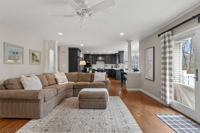 57 Paderewski Road Oak Ridge, NJ 07438 - Photo 35 of 42 a living room with furniture and a large window