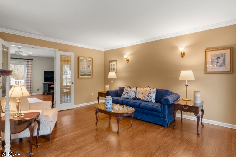 57 Paderewski Road Oak Ridge, NJ 07438 - Photo 37 of 42 a living room with furniture and a wooden floor