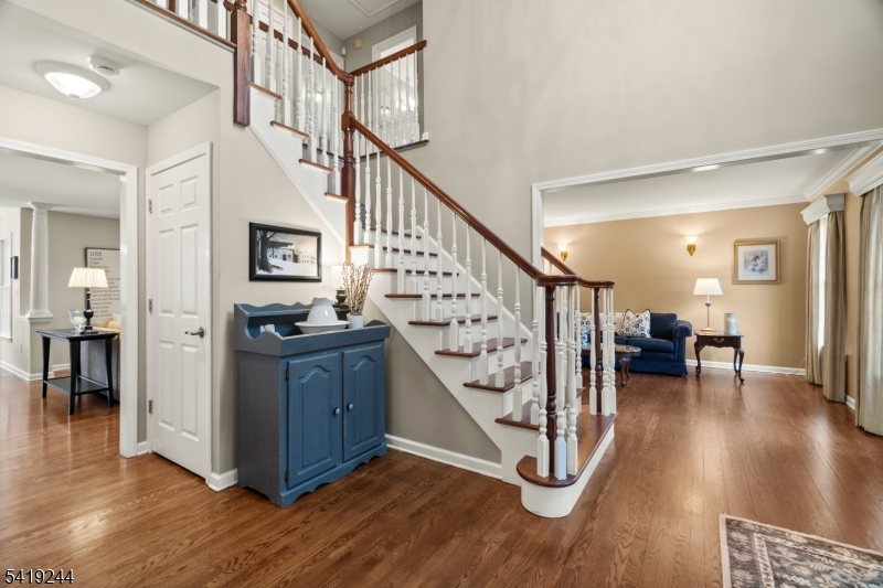 57 Paderewski Road Oak Ridge, NJ 07438 - Photo 38 of 42 a view of entryway dining room and hall with wooden floor